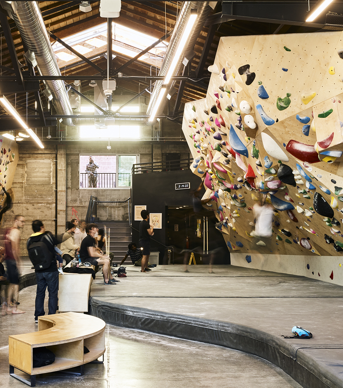Climbers socializing inside Mosaic Boulders