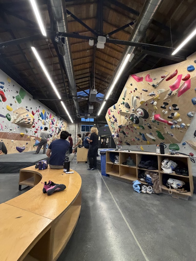 Climber resting inside Mosaic Boulders